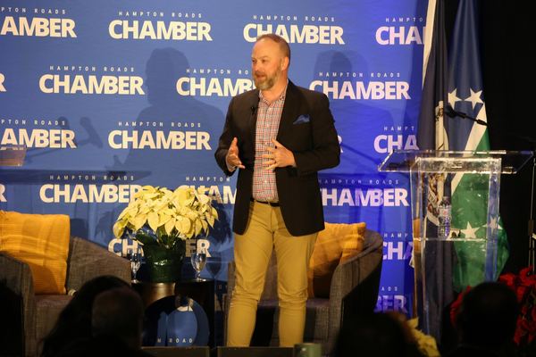 Michael Bach delivering a keynote on stage at the Hampton Roads Chamber of Commerce.
